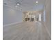 Open living area showcasing hardwood floors and kitchen view at 821 E 1St Ave, New Smyrna Beach, FL 32169