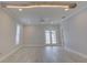 Bright living room with hardwood floors and french doors at 821 E 1St Ave, New Smyrna Beach, FL 32169
