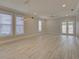 Open concept living room with hardwood floors and natural light at 821 E 1St Ave, New Smyrna Beach, FL 32169