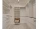 Large walk-in closet with shelving and drawers at 821 E 1St Ave, New Smyrna Beach, FL 32169
