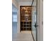 Walk-in wine cellar featuring glass door and ample storage at 821 E 1St Ave, New Smyrna Beach, FL 32169