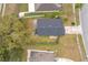 Aerial view of single-Gathering home with yard and driveway at 9606 Chandon Dr, Orlando, FL 32825