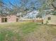Backyard with patio, shed, and fenced area at 9606 Chandon Dr, Orlando, FL 32825