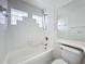 Updated bathroom with a shower/tub combo and a large mirror at 9606 Chandon Dr, Orlando, FL 32825