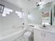 Clean bathroom with a bathtub, shower, and vanity at 9606 Chandon Dr, Orlando, FL 32825