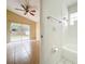 Bathroom with a tub, toilet, and access to a bedroom at 9606 Chandon Dr, Orlando, FL 32825