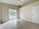 Bedroom with sliding door access to the backyard at 9606 Chandon Dr, Orlando, FL 32825