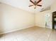 Spacious bedroom with tile floors and ceiling fan at 9606 Chandon Dr, Orlando, FL 32825