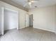 Simple bedroom with tile flooring and a large closet at 9606 Chandon Dr, Orlando, FL 32825
