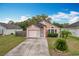 Charming one-story home with a two-car garage and landscaped yard at 9606 Chandon Dr, Orlando, FL 32825