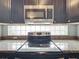 Stainless steel appliances and granite countertops in this updated kitchen at 9606 Chandon Dr, Orlando, FL 32825