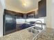 Modern kitchen with stainless steel sink and granite countertops at 9606 Chandon Dr, Orlando, FL 32825