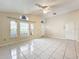 Spacious living room featuring tile floors and lots of natural light at 9606 Chandon Dr, Orlando, FL 32825
