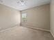 Bedroom with neutral paint, standard window, and carpet flooring at 10097 Leland Dr, Orlando, FL 32827