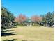 Beautiful community park with lush green space and a charming gazebo, perfect for relaxation and recreation at 10097 Leland Dr, Orlando, FL 32827