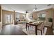 Bright dining area with hardwood floors and modern chandelier at 10097 Leland Dr, Orlando, FL 32827