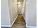 Hallway with light colored walls and dark wood floors at 10097 Leland Dr, Orlando, FL 32827