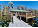 Private lake access with a floating dock and gazebo at 10097 Leland Dr, Orlando, FL 32827