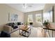Inviting living room with neutral paint, stylish furnishings, and plenty of natural light at 10097 Leland Dr, Orlando, FL 32827