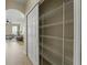 Pantry closet with metal shelving providing ample space for food storage and organization at 10097 Leland Dr, Orlando, FL 32827