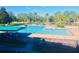 Community pool with lanes, shade structure, and lounge chairs at 10097 Leland Dr, Orlando, FL 32827