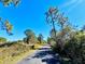 Paved trail winding through a wooded area at 10097 Leland Dr, Orlando, FL 32827