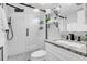 Modern bathroom with white subway tile, granite countertop, and walk-in shower at 111 N Atlantic Ave # 2090, New Smyrna Beach, FL 32169