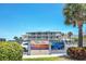 Win-San building sign with parking and landscaping at 111 N Atlantic Ave # 2090, New Smyrna Beach, FL 32169