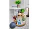 Wooden tiered tray with keys and other guest information at 111 N Atlantic Ave # 2090, New Smyrna Beach, FL 32169