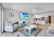 Open concept living room and kitchen with modern finishes and plenty of natural light at 111 N Atlantic Ave # 2090, New Smyrna Beach, FL 32169