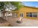 Backyard patio with fire pit and pergola at 11944 Cheltinham Dr, Orlando, FL 32824