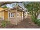 Backyard patio, pergola, and access to home at 11944 Cheltinham Dr, Orlando, FL 32824
