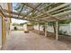 Backyard patio with pergola, fire pit, and shed at 11944 Cheltinham Dr, Orlando, FL 32824