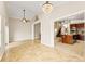 Spacious dining room with tile floors and access to patio at 11944 Cheltinham Dr, Orlando, FL 32824