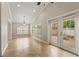 Bright dining room with tile flooring and access to backyard at 11944 Cheltinham Dr, Orlando, FL 32824