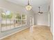 Bright dining room with large windows and tile floors at 11944 Cheltinham Dr, Orlando, FL 32824