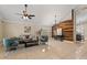 Spacious living room with vaulted ceiling and wood accent wall at 11944 Cheltinham Dr, Orlando, FL 32824