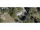 Aerial view showing a single-Gathering home on a tree-lined lot at 121 Valencia Dr, Edgewater, FL 32132