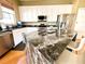 Kitchen boasts granite countertops and a large island at 13328 Lake Turnberry Cir, Orlando, FL 32828