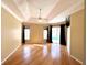 Main bedroom with hardwood floors and sliders opening to the pool at 13328 Lake Turnberry Cir, Orlando, FL 32828
