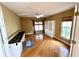 Home office with built-in shelving and hardwood floors at 13328 Lake Turnberry Cir, Orlando, FL 32828