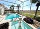 Serene pool and spa with a view of the golf course at 13328 Lake Turnberry Cir, Orlando, FL 32828