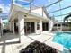 Relaxing pool area with screened enclosure and lush landscaping at 13328 Lake Turnberry Cir, Orlando, FL 32828
