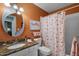 Bathroom with flamingo-themed decor, granite countertop and shower at 1339 Villa Ln # 50, Apopka, FL 32712