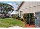 Home exterior showcasing side yard and golf course view at 1339 Villa Ln # 50, Apopka, FL 32712