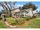 Side view of home highlighting sunroom and landscaping at 1339 Villa Ln # 50, Apopka, FL 32712