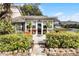Front view of charming home with sunroom and landscaping at 1339 Villa Ln # 50, Apopka, FL 32712