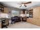 Bright home office featuring two work stations and built-in shelving at 1339 Villa Ln # 50, Apopka, FL 32712