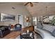 Bright living room with vaulted ceiling, hardwood floors, and kitchen view at 1339 Villa Ln # 50, Apopka, FL 32712