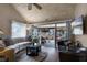 Relaxing living room featuring vaulted ceiling, hardwood floors and access to screened porch at 1339 Villa Ln # 50, Apopka, FL 32712